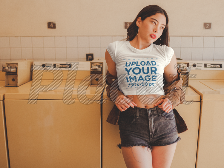 placeit girl wearing a crop top tee template and a jacket at the